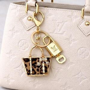 Authentic Louis Vuitton Gold Lock & Key with unbranded Leopard Mini Bagcharm